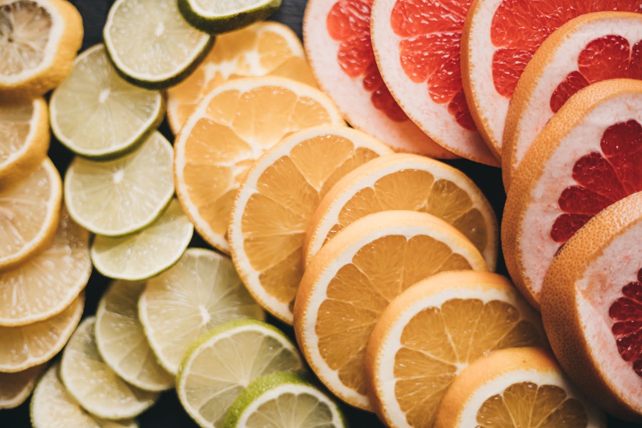 Close-up of various sliced citrus fruits showcasing vibrant colors and textures.